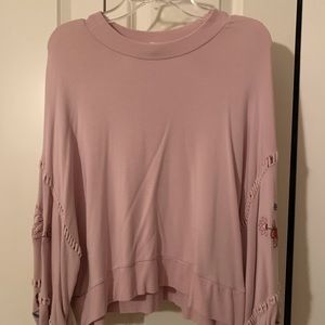 Pink shirt with detail on the arms